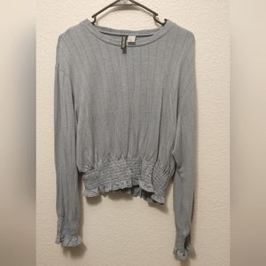 Soft, ruffle trimmed knit top
